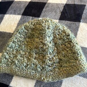 Green knit beanie with ponytail hole on top